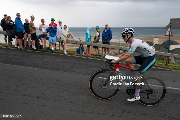 Cyclist not participating in the race cycles up Saltburn bank carrying a tray of fish and chips during the Men’s British National Road Championships...