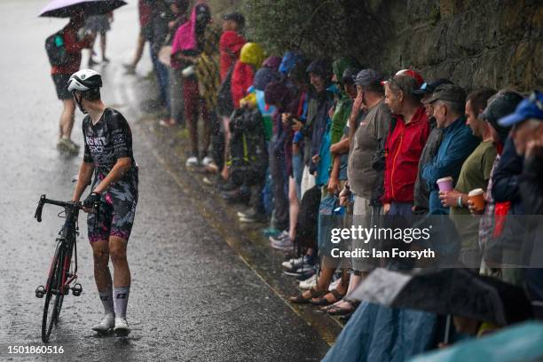 Spectators take shelter from a heavy shower during the Men’s British National Road Championships road race on June 25, 2023 in Saltburn, England. The...