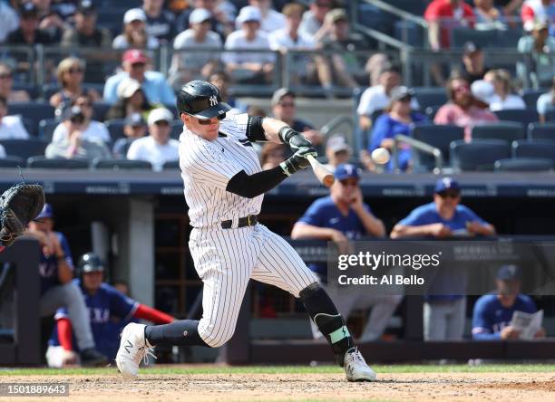 Harrison Bader of the New York Yankees drives in two runs with a double in the eighth against the Texas Rangers inning during their game at Yankee...