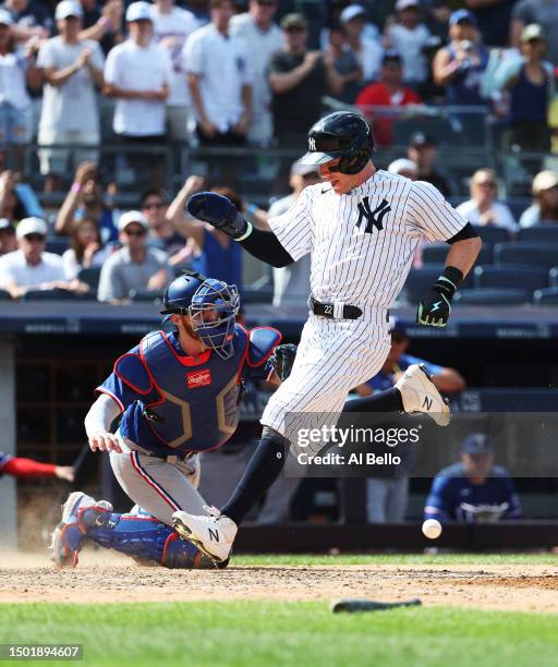 Harrison Bader of the New York Yankees scores a run off a single by Giancarlo Stanton in the eighth inning against the Texas Rangers during their...