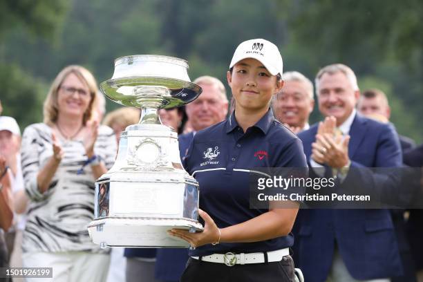 Ruoning Yin of China poses for a photo with the trophy during the awards ceremony after winning the KPMG Women's PGA Championship at Baltusrol Golf...