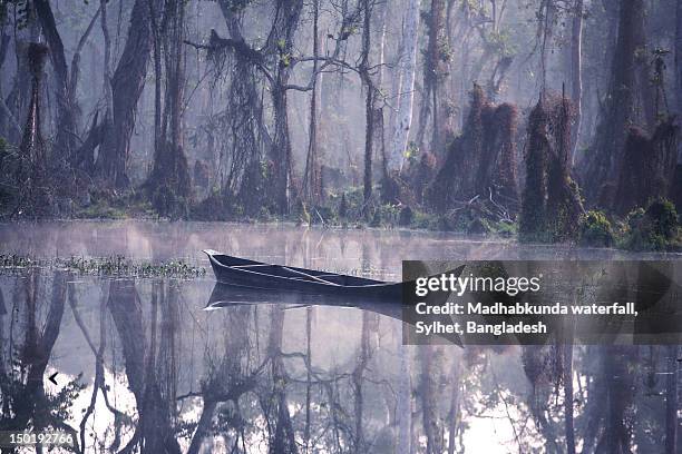 old wooden boat in river - madhabkunda stock pictures, royalty-free photos & images