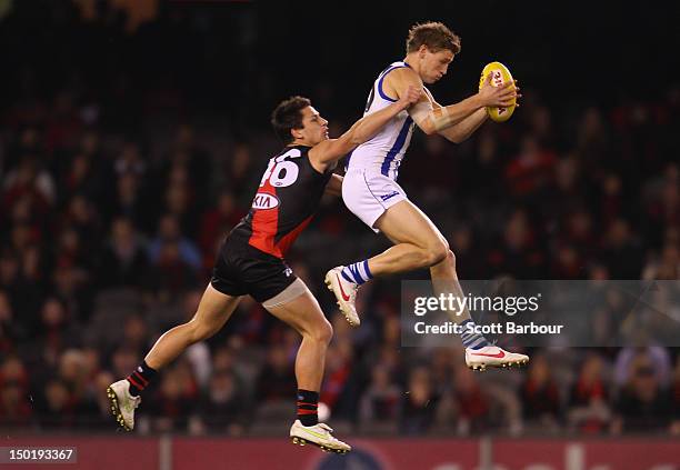 Kieran Harper of the Kangaroos takes a mark during the round 20 AFL match between the Essendon Bombers and the North Melbourne Kangaroos at Etihad...