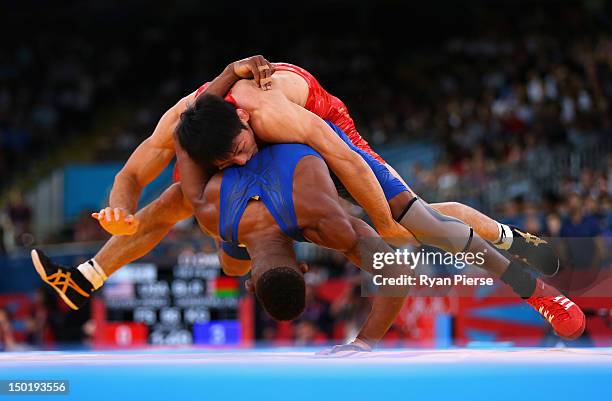 Tatsuhiro Yonemitsu of Japan in action against Livan Lopez Azcuy of Cuba in the Men's Freestyle Wrestling 66kg 1/8 final match on Day 16 of the...