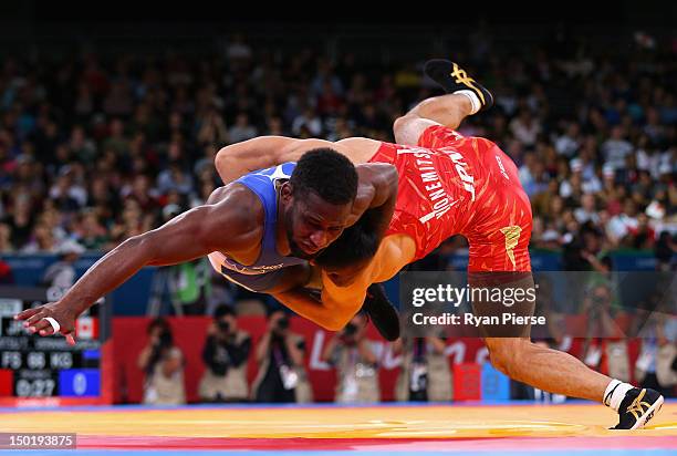 Tatsuhiro Yonemitsu of Japan in action against Haislan Veranes Garcia of Canada in the Men's Freestyle Wrestling 66kg Quarter final match on Day 16...