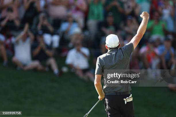 Keegan Bradley of the United States celebrates winning on the 18th green during the final round of the Travelers Championship at TPC River Highlands...