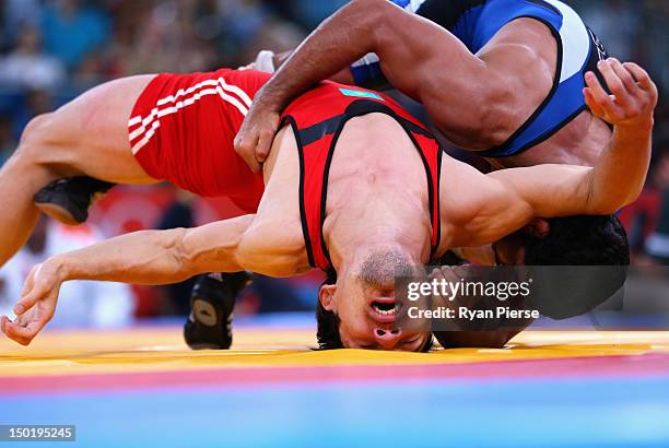 Sushil Kumar of India in action against Akzhurek Tanatarov of Kazakhstan during the Men's Freestyle Wrestling 66kg semi final match on Day 16 of the...