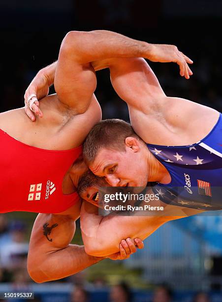 Jacob Stephen Varner of the United States in action against George Gogshelidze of Georgia during the Men's Freestyle Wrestling 96kg semi final match...