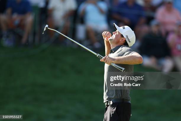 Keegan Bradley of the United States celebrates winning on the 18th green during the final round of the Travelers Championship at TPC River Highlands...