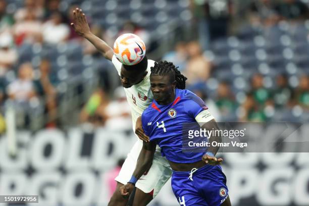 Mohammed Muntari of Qatar goes for a header against Ricardo Ade of Haiti during a Group B match between Haiti and Qatar as part of the 2023 CONCACAF...