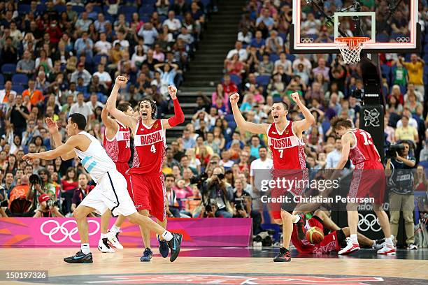 Alexey Shved of Russia and Vitaliy Fridzon of Russia celebrate winning the Men's Basketball bronze medal game between Russia and Argentina on Day 16...