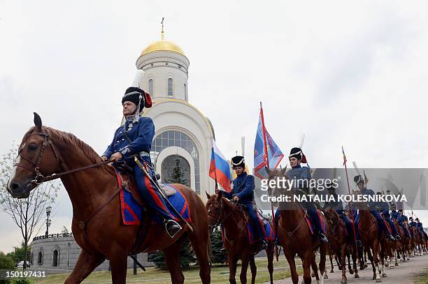 Russian cossacks, wearing historic outfits ride horses during the start of their march fromthe Poklonnaya Gora Memorial Park in Moscow to Paris on...