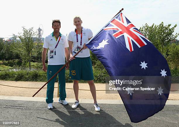 Captain Lauren Jackson of the Australian Women's basketball team poses with closing ceremony flag bearer, gold medallist sailor Malcolm Page during...