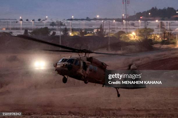 An Israeli UH-60 Black Hawk helicopter takes off to evacuate wounded persons near the Muqeibila border crossing between Israel and the occupied West...