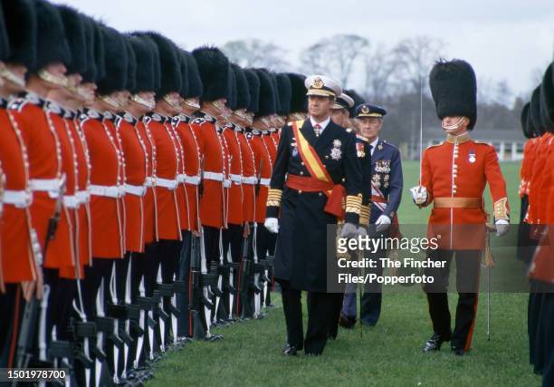 King Juan Carlos I of Spain inspecting Grenadier Guards whilst on a State Visit to Britain, circa April 1986 .