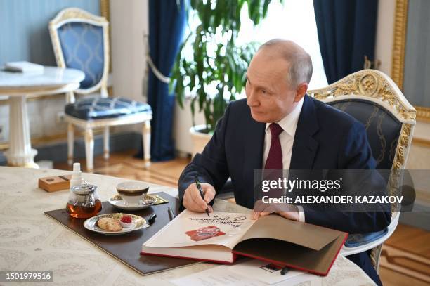 Russian President Vladimir Putin meets with Raisat Akipova, an 8-year-old girl from Derbent, who failed to see the head of state during his working...