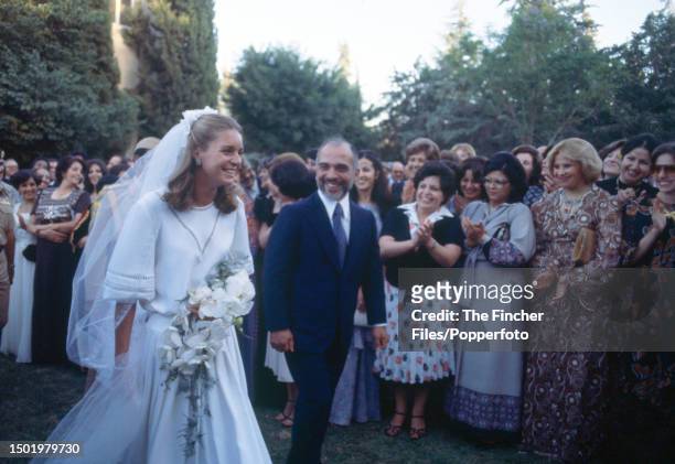 King Hussein of Jordan and his bride Lisa Halaby, soon to be Queen Noor al Hussein, following their wedding at the Royal Palace in Amman on 15th June...