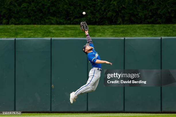 Kyle Isbel of the Kansas City Royals jumps but can't catch a ball hit by Donovan Solano of the Minnesota Twins for a double in the third inning at...