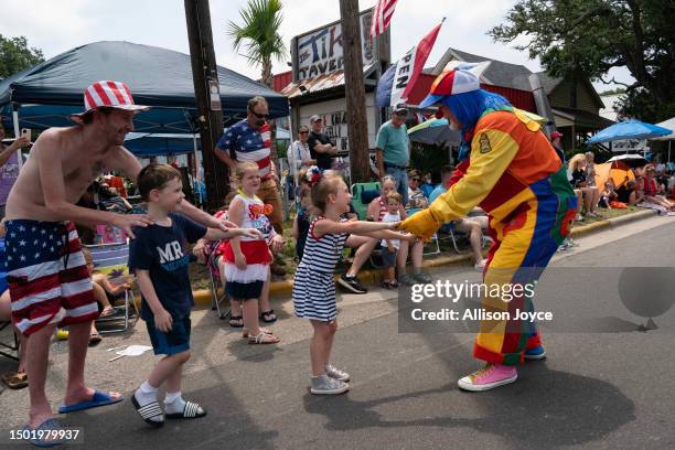 Residents participate in the annual Independence Day Parade on July 4, 2023 in Southport, North Carolina. The U.S. Declaration of Independence was...