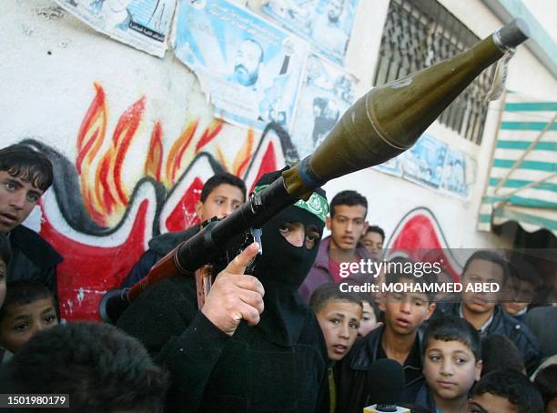 Palestinian militant of the radical Hamas movement holds a rocket-propelled grenade launcher near the house of Hamas spiritual leader Sheikh Ahmed...