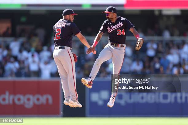 Luis Garcia of the Washington Nationals celebrates with Derek Hill after defeating the San Diego Padres 8-3 at PETCO Park on June 25, 2023 in San...