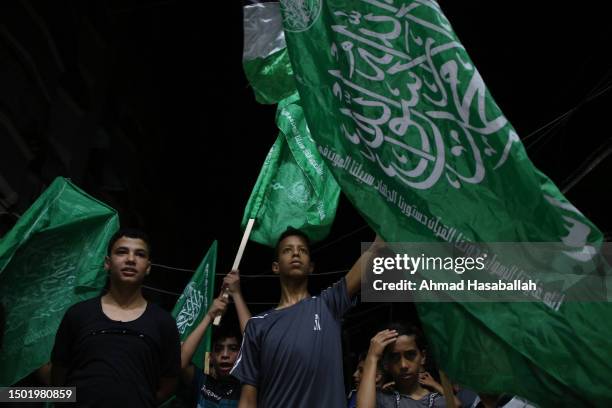 Hamas supporters wave green Islamic flags during a solidarity demonstration protesting the storming of Jenin on July 4, 2023 in Gaza City, Gaza. 11...