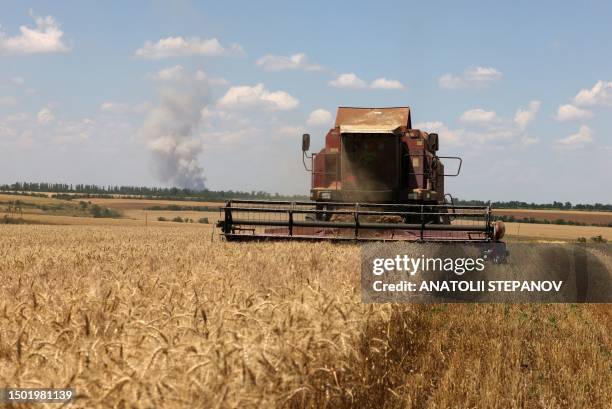 Combine harvests wheat on a field near Novosofiivka village, Mykolaiv region on July 4, 2023. Ukraine was one of the world's top grain producers, and...
