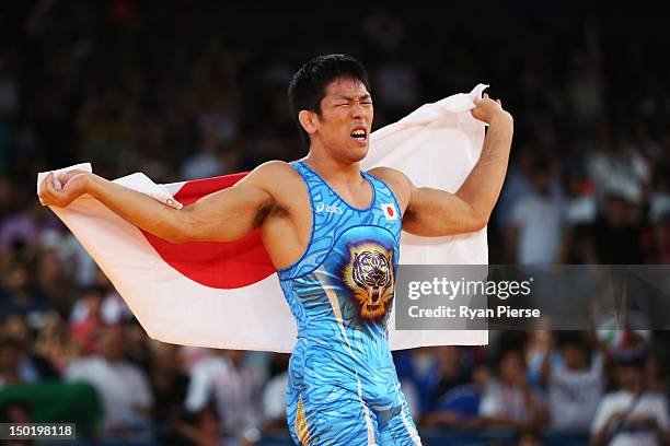 Tatsuhiro Yonemitsu of Japan celebrates his victory against Sushil Kumar of India during the Men's Freestyle 66 kg Wrestling gold medal fight on Day...