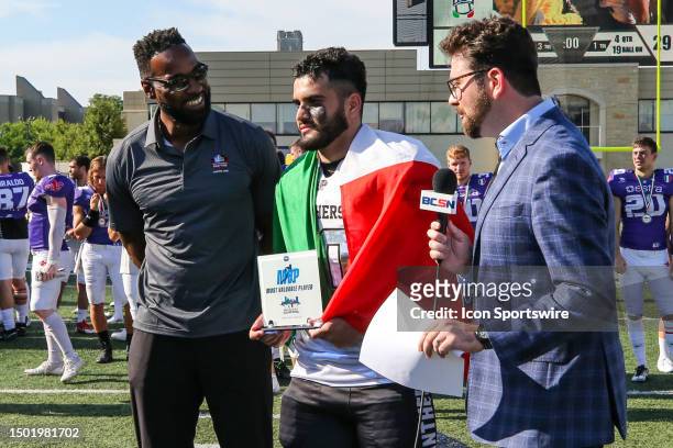 Parma Panthers linebacker Alexis Rafael Ramos , center, is presented the Most Valuable Player award, while former NFL wide receiver Calvin Johnson,...