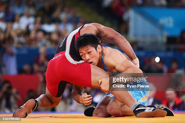 Tatsuhiro Yonemitsu of Japan in action against against Sushil Kumar of India during the Men's Freestyle 66 kg Wrestling gold medal fight on Day 16 of...