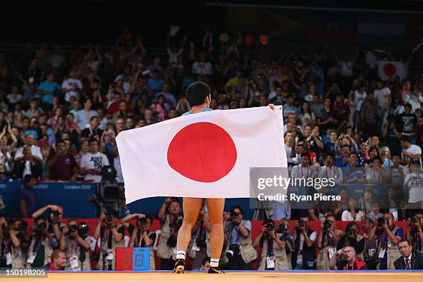 Tatsuhiro Yonemitsu of Japan celebrates his victory against Sushil Kumar of India during the Men's Freestyle 66 kg Wrestling gold medal fight on Day...