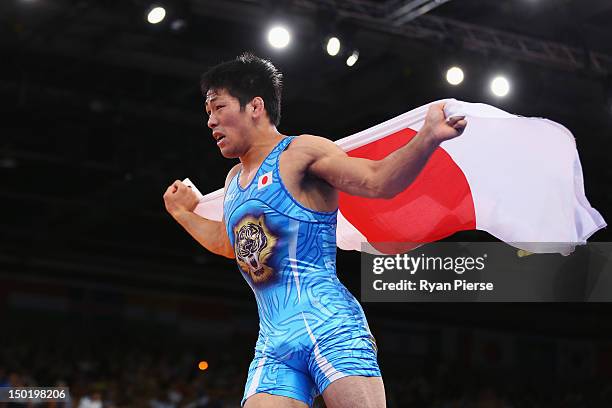 Tatsuhiro Yonemitsu of Japan celebrates his victory against Sushil Kumar of India during the Men's Freestyle 66 kg Wrestling gold medal fight on Day...