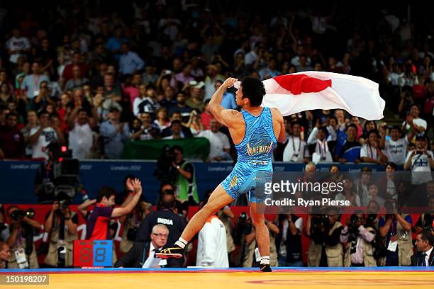 Tatsuhiro Yonemitsu of Japan celebrates his victory against Sushil Kumar of India during the Men's Freestyle 66 kg Wrestling gold medal fight on Day...