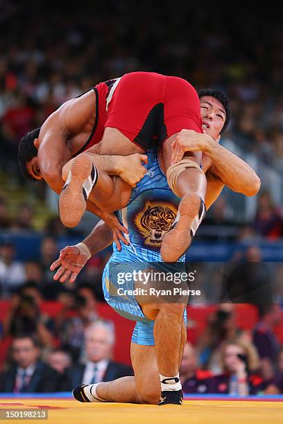 Tatsuhiro Yonemitsu of Japan in action against against Sushil Kumar of India during the Men's Freestyle 66 kg Wrestling gold medal fight on Day 16 of...