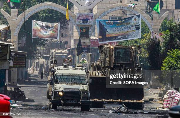 An Israeli military bulldozer crosses into the center of the Jenin refugee camp, during the storming. Palestinian health officials said at least 10...