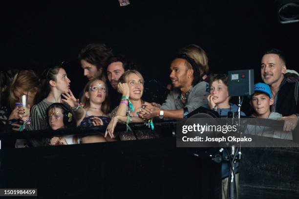 Aaron Taylor-Johnson, Sam Taylor-Johnson, Lewis Hamilton and David Furnish and Zachary Furnish-John and Elijah Furnish-John watch Elton John from...