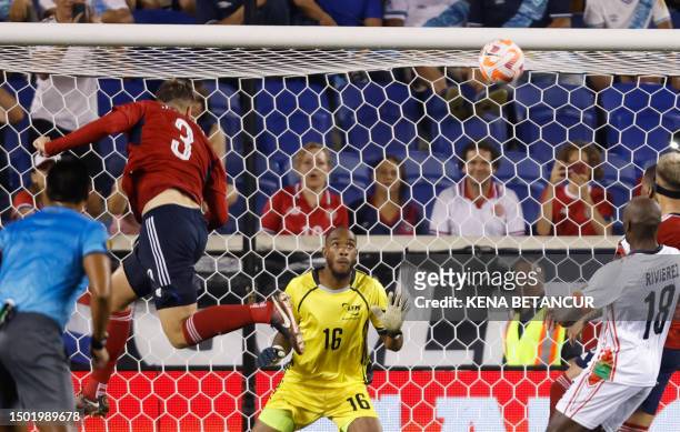 Costa Rica's defender Juan Pablo Vargas heads the ball and scores his team's third goal during the Concacaf 2023 Gold Cup Group C football match...