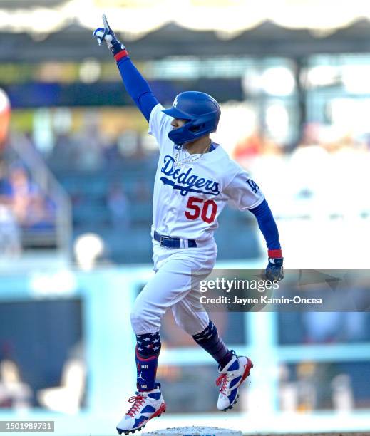 Mookie Betts of the Los Angeles Dodgers rounds the bases after hitting a solo home run in the second inning against the Pittsburgh Pirates at Dodger...