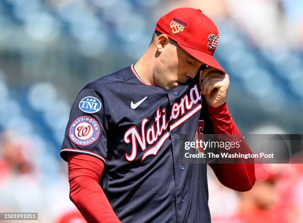 Washington Nationals starting pitcher Patrick Corbin wipes away sweat during action against the Cincinnati Reds at Nationals Park on July 4, 2023.