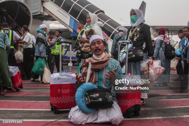 Muslim pilgrims arrive at Juanda International airport, in Sidoarjo, East Java, Indonesia, on July 4 after completing the hajj pilgrimage in Saudi...