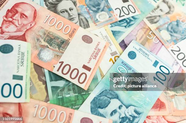 July 2023, Serbia, Belgrad: Serbian dinar banknotes are lying on a table. Photo: Silas Stein/dpa