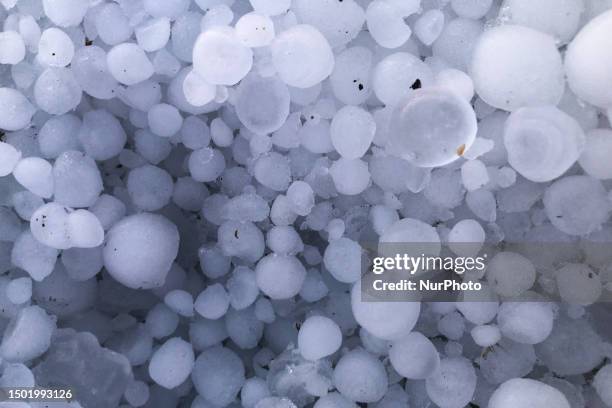 Lots of hailstones are seen after a huge hail storm in L'Aquila, Italy, on July 4, 2023.