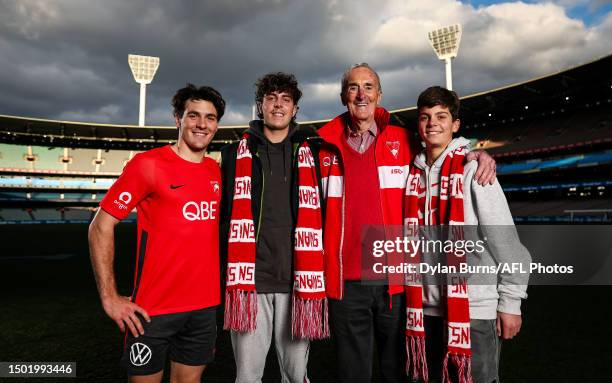 Errol Gulden of the Swans poses for a photo with Former South Melbourne player John Heriot and his grandchildren Lachy & Ashton Heriot during the...