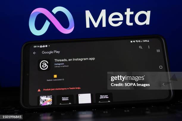 In this photo illustration, Threads logo seen displayed on a smartphone with the Meta logo in the background. Meta will release a social media app...