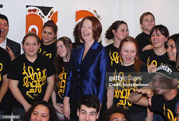 Australian Prime Minister Julia Gillard laughs as she stands with indigenous children after launching the Korin Gamadji Institute at the ME Bank...