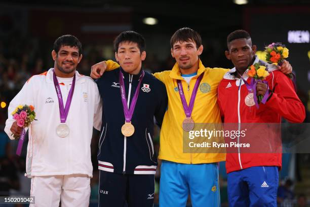 Gold medallist Tatsuhiro Yonemitsu of Japan, silver medallist Sushil Kumar of India, bronze medallists Akzhurek Tanatarov of Kazakhstan and Livan...