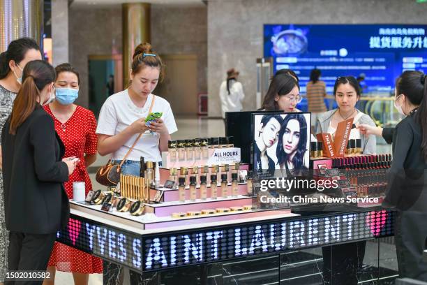 Customers purchase cosmetics at CDF Haikou International Duty Free City on June 25, 2023 in Haikou, Hainan Province of China. The Haikou CDF Haikou...