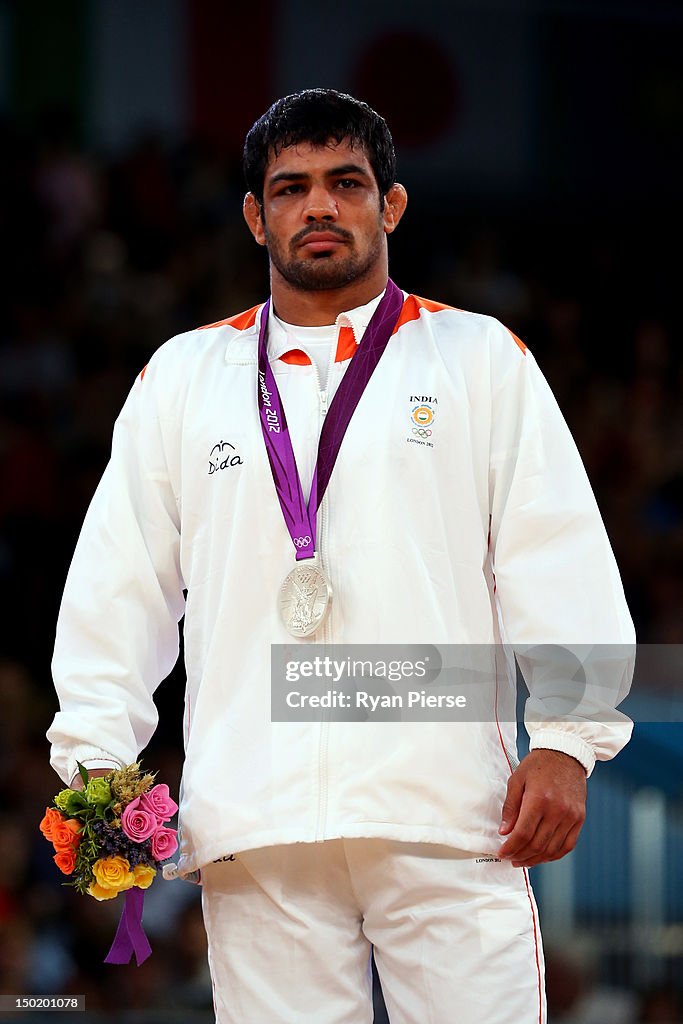 Silver medallist Sushil Kumar of India celebrates with his medal ...