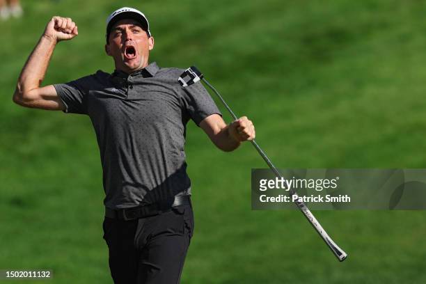 Keegan Bradley of the United States celebrates winning on the 18th green during the final round of the Travelers Championship at TPC River Highlands...