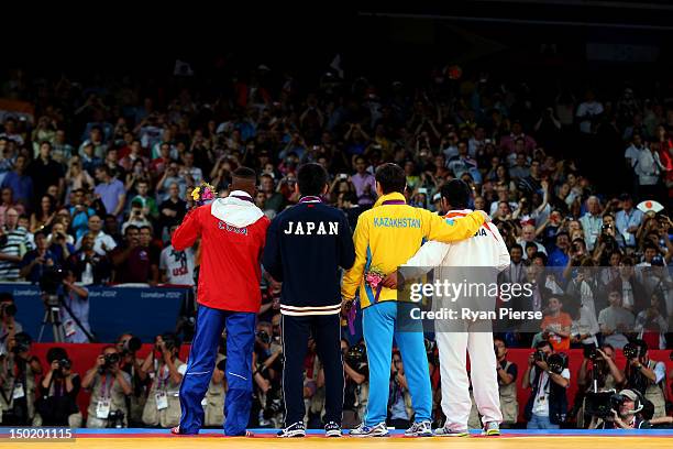 Gold medallist Tatsuhiro Yonemitsu of Japan, silver medallist Sushil Kumar of India, bronze medallists Akzhurek Tanatarov of Kazakhstan and Livan...